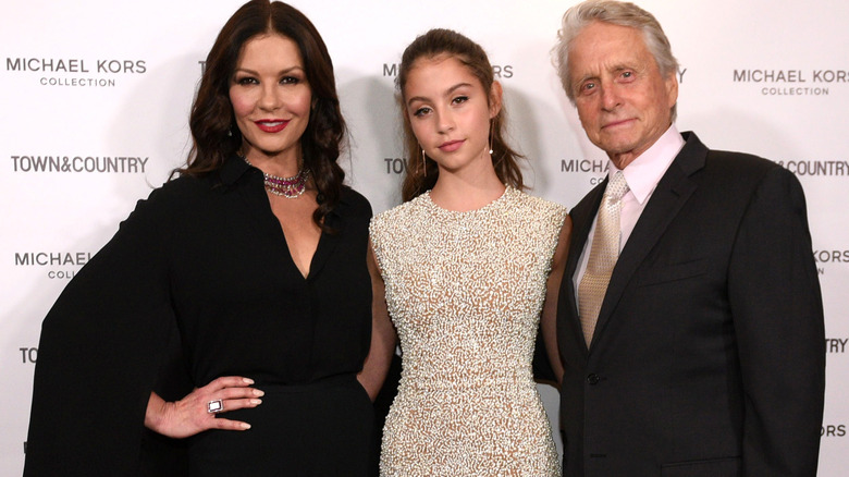 Catherine Zeta-Jones, Carys Zeta Douglas and Michael Douglas on red carpet