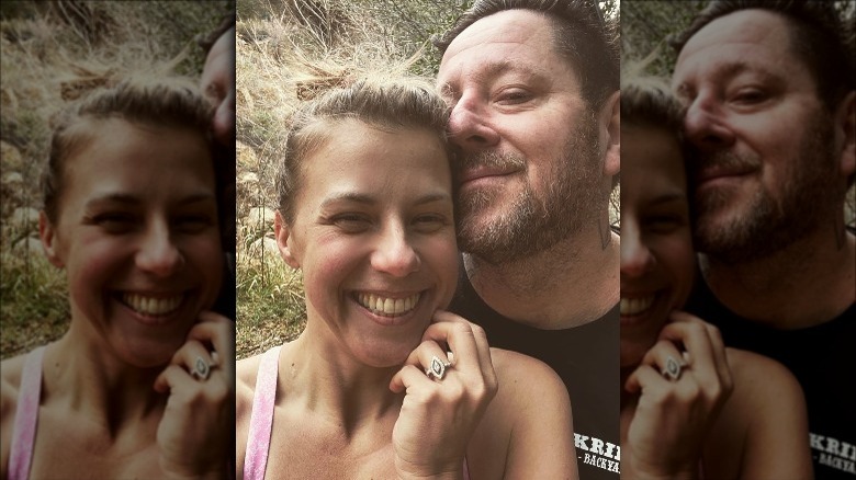 Jodie Sweetin posing with her fiance and engagement ring