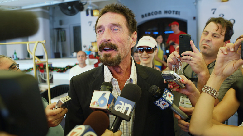 john mcafee talks to reporters