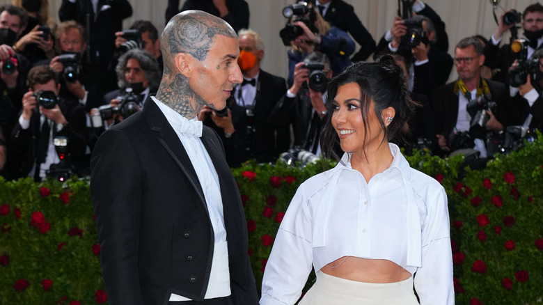 Kourtney Kardashian and Travis Barker smiling