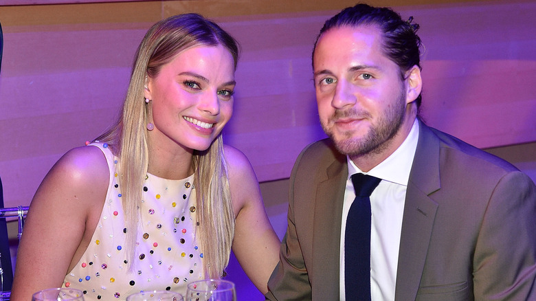 Margot Robbie smiling with husband Tom Ackerley