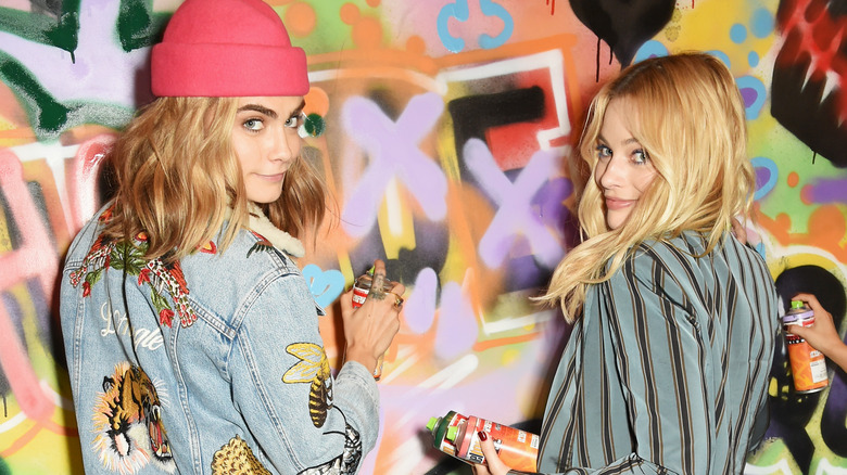 Margot Robbie and Cara Delevingne posing