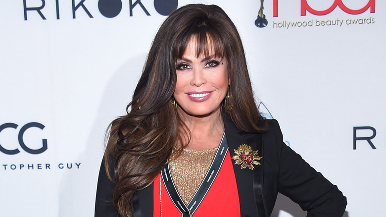 Marie Osmond smiles at a red carpet event