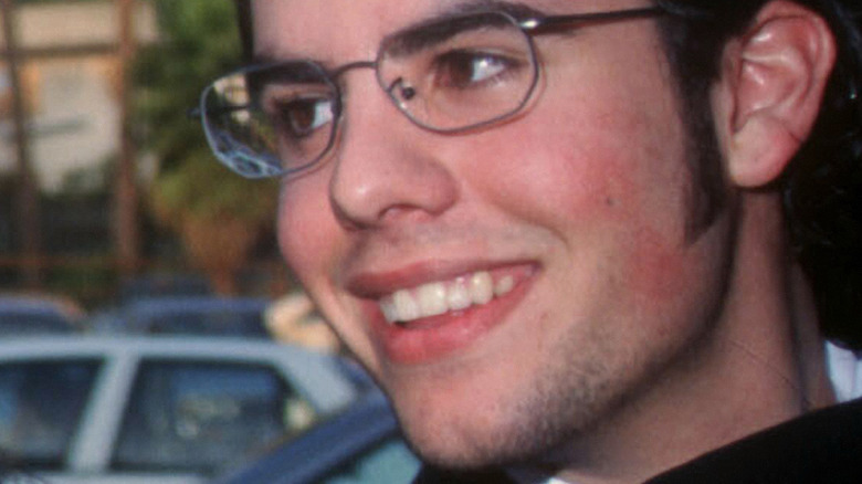 Sage Stallone smiling in glasses