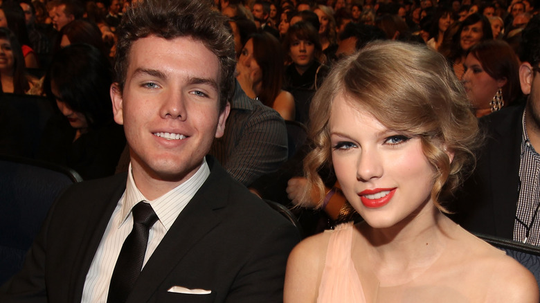 Austin and Taylor Swift sitting in the audience at an awards show