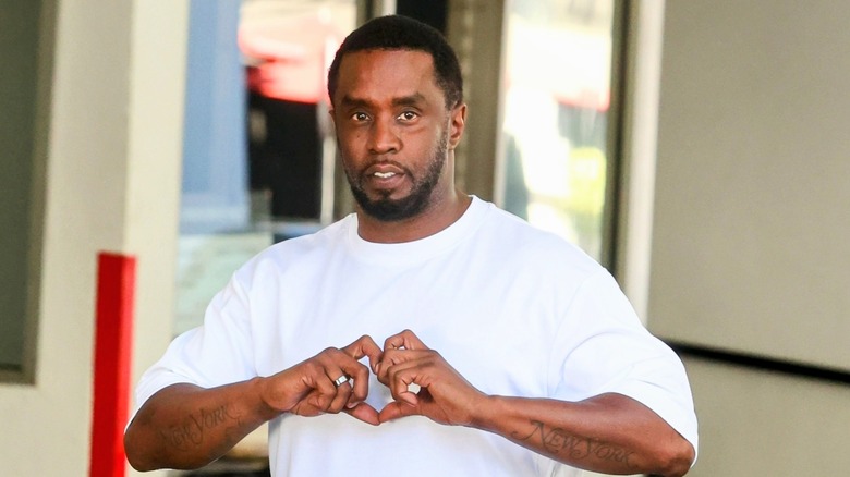 Sean Combs making a heart with his hands