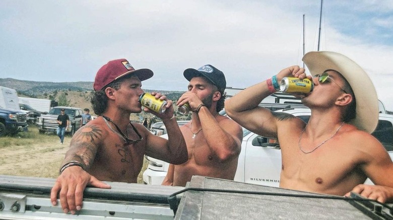 The Montana Boyz chugging drinks while shirtless