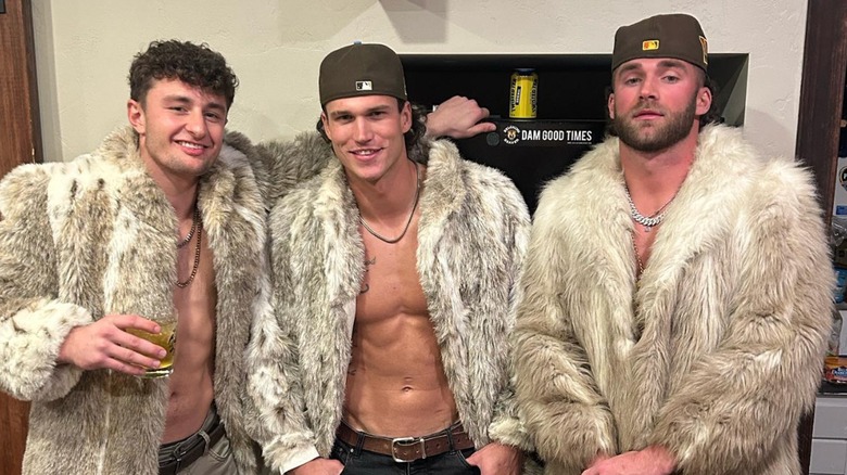 The Montana Boyz posing in fur coats