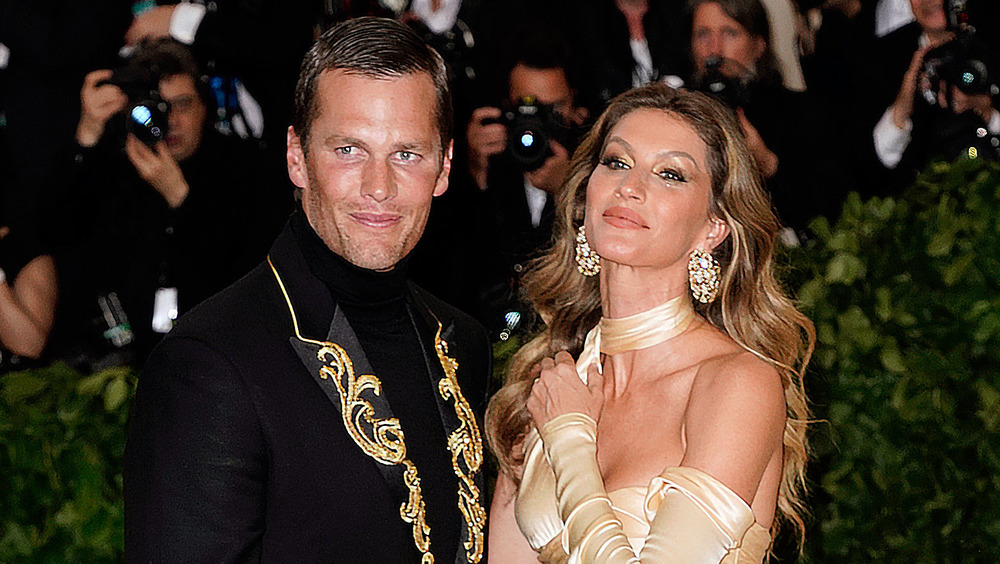 Gisele Bundchen and Tom Brady posing on red carpet