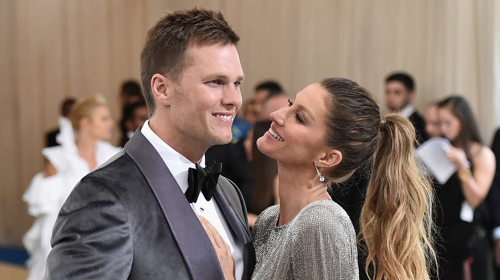 Tom Brady and Gisele Bundchen looking at each other