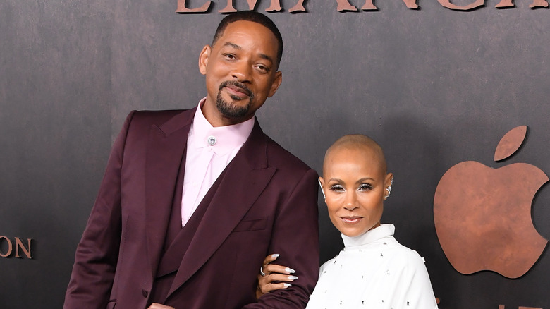 Will Smith and Jada Pinkett posing on the red carpet