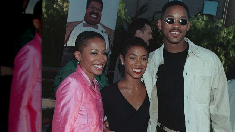 Will Smith, Jada Pinkett and Adrienne Banfield-Norris posing on red carpet