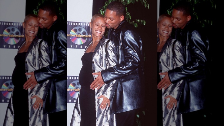 Will Smith embracing Jada Pinkett's baby bump, both smiling