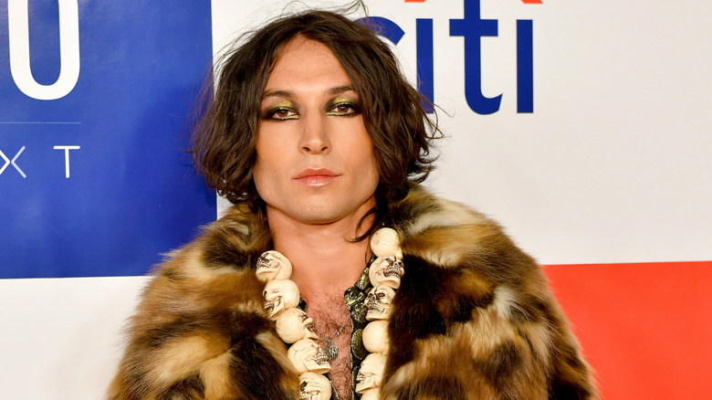 Ezra Miller in fur coat