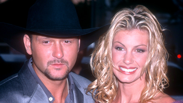 Tim McGraw and Faith Hill pose side by side