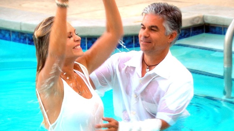 Tamra Judge getting baptised in a swimming pool