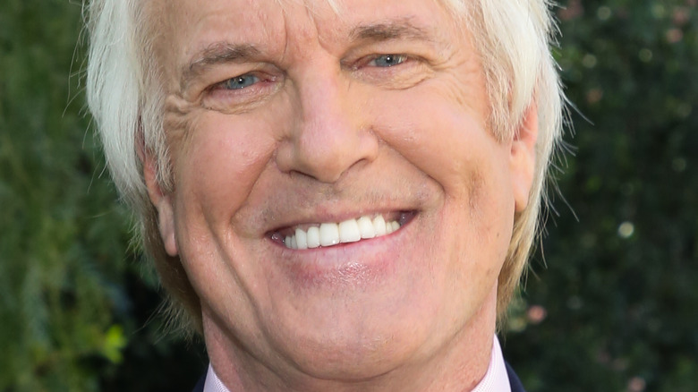 John Tesh with wide smile