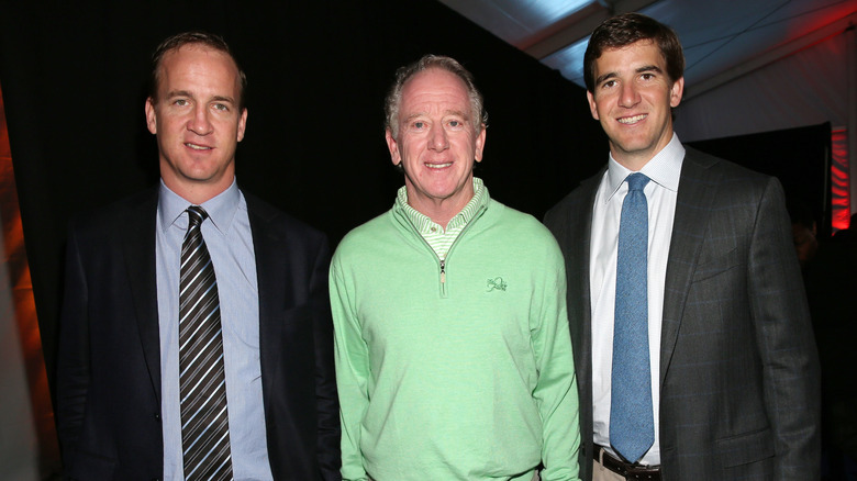 Eli, Archie and Peyton Manning smile