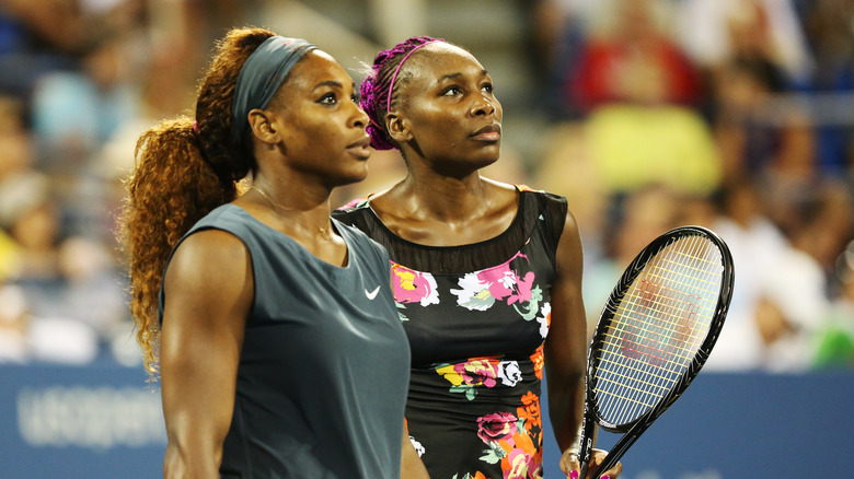 Serena and Venus Williams on tennis court