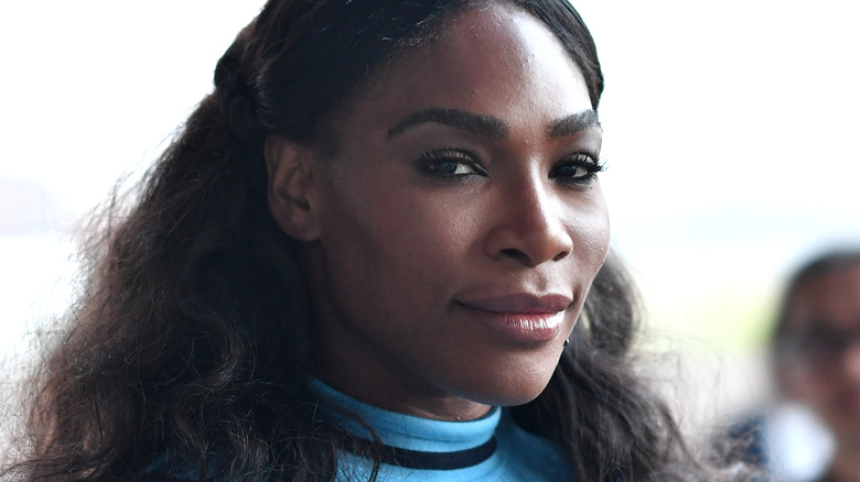 Serena Williams wearing a blue sweater