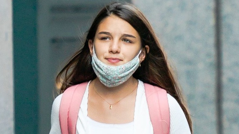 Suri Cruise wearing mask and white top