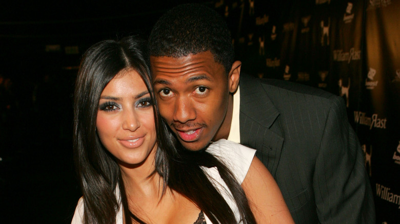 Kim Kardashian and Nick Cannon pose together