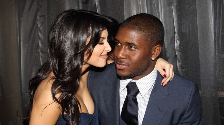 Kim Kardashian and Reggie Bush pose together at the Fontainebleau Hotel