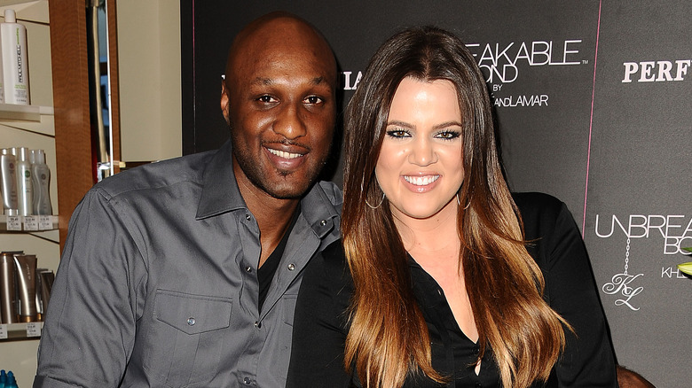 Lamar Odom and Khloe Kardashian pose together at Perfumania