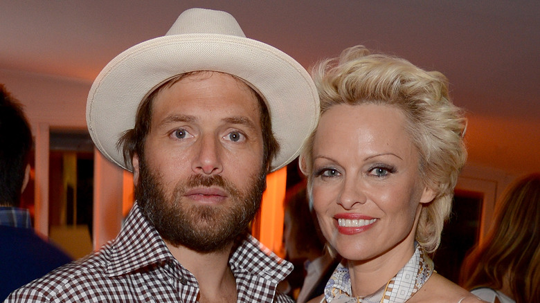 Rick Salomon posing with Pamela Anderson