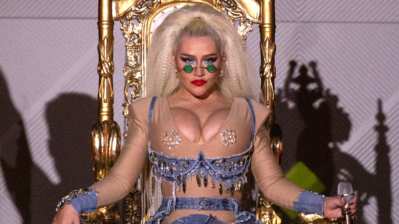 Christina Aguilera sitting on a throne