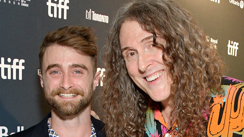 Daniel Radcliffe and Weird Al Yankociv smiling