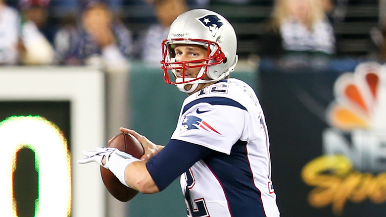 Tom Brady throws a ball