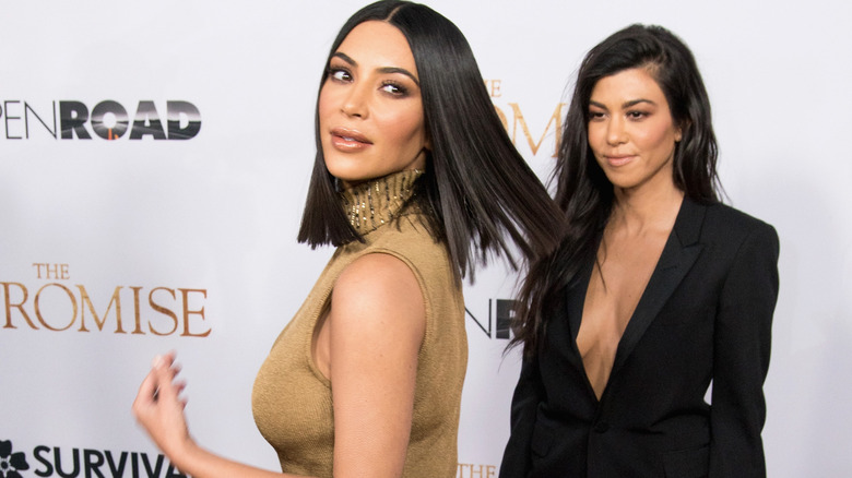 Kim and Kourtney Kardashian hair flip