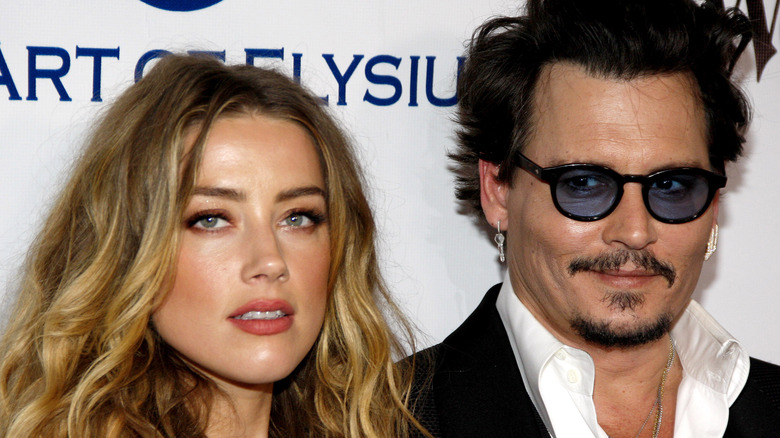 Amber Heard and Johnny Depp posing