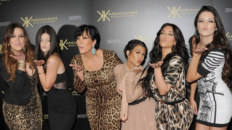 Kardashian-Jenner women blowing kisses to the camera