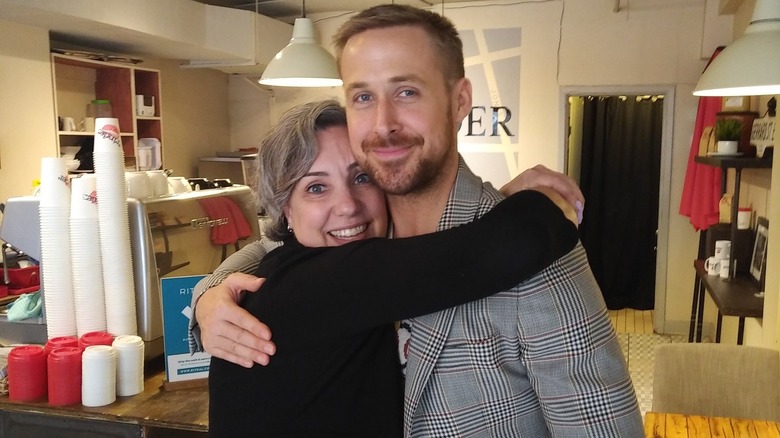 The owner of Grinder Coffee hugging Ryan Gosling