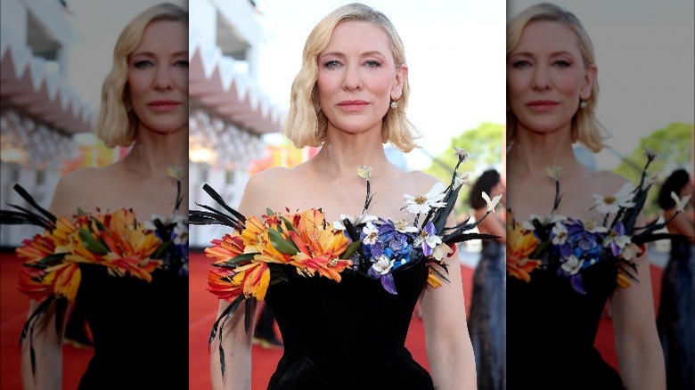 Cate Blanchett posing in a dress with flowers