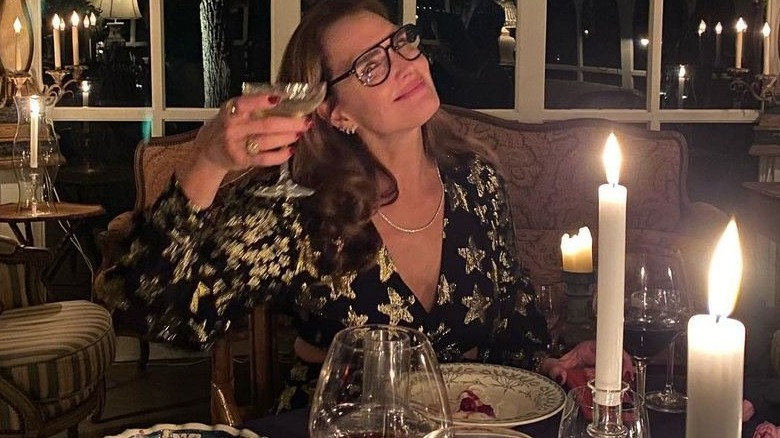 Brooke Shields posing with drink