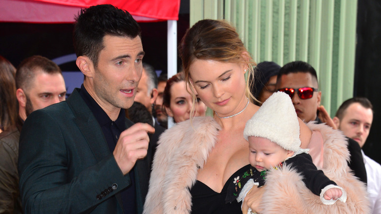 Adam Levine with wife and daughter, speaking