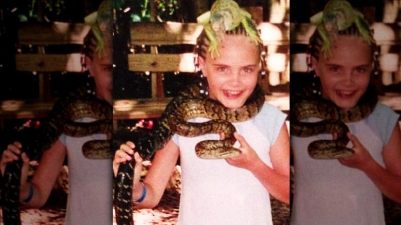 Cara Delevingne childhood holding snake