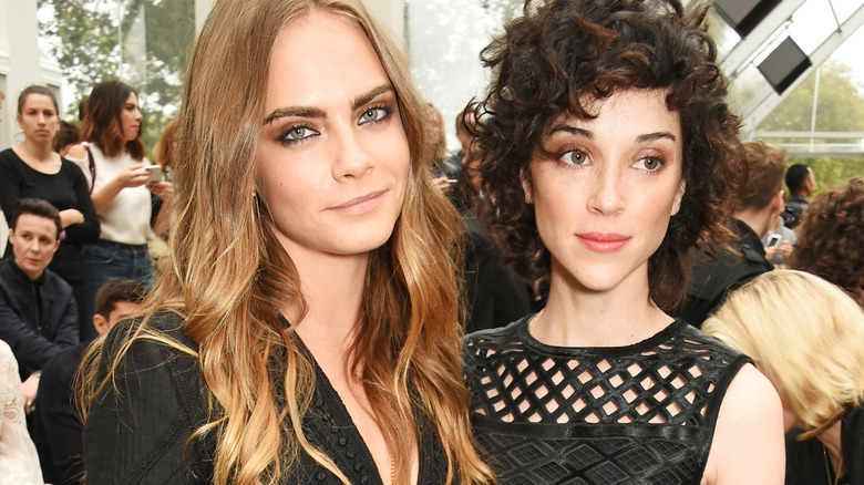 Cara Delevingne and St. Vincent smiling 