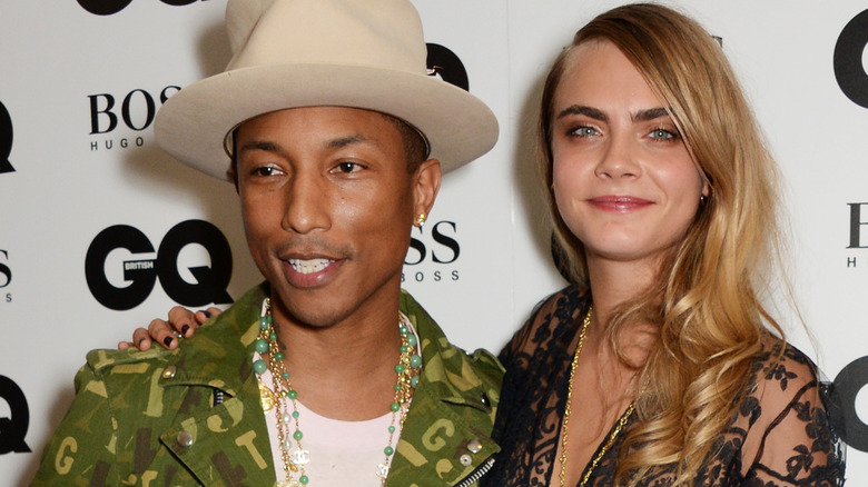 Cara Delevingne smiling with Pharrell