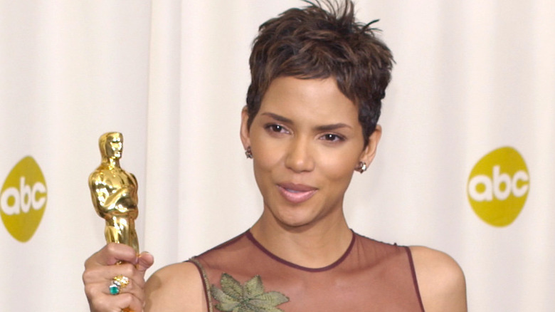 Halle Berry holding award