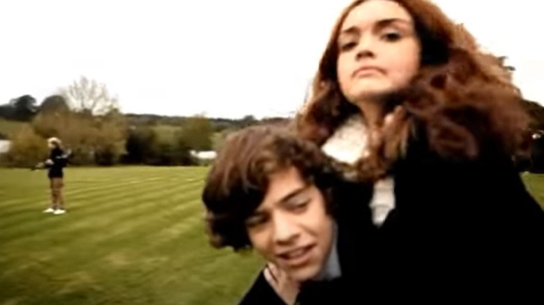 Harry Styles and Olivia Cooke in a One Direction music video.