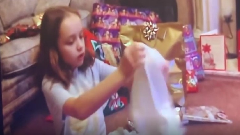 Olivia Cooke opening gifts when she was little.