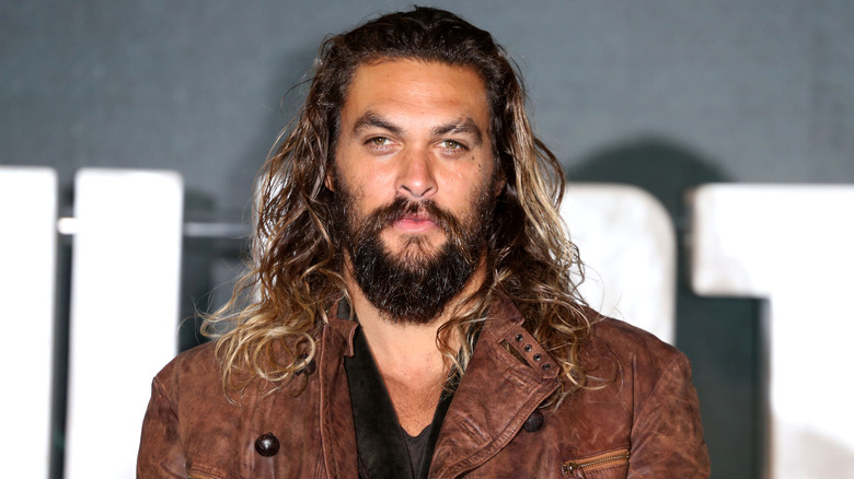 Jason Momoa with long hair and a beard