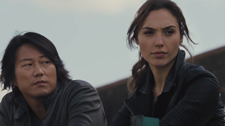 Sung Kang looking at Gal Gadot in "Fast & Furious"