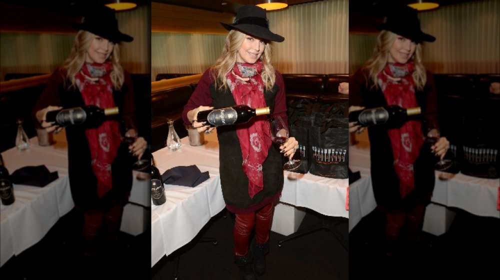 Fergie holding a bottle of wine