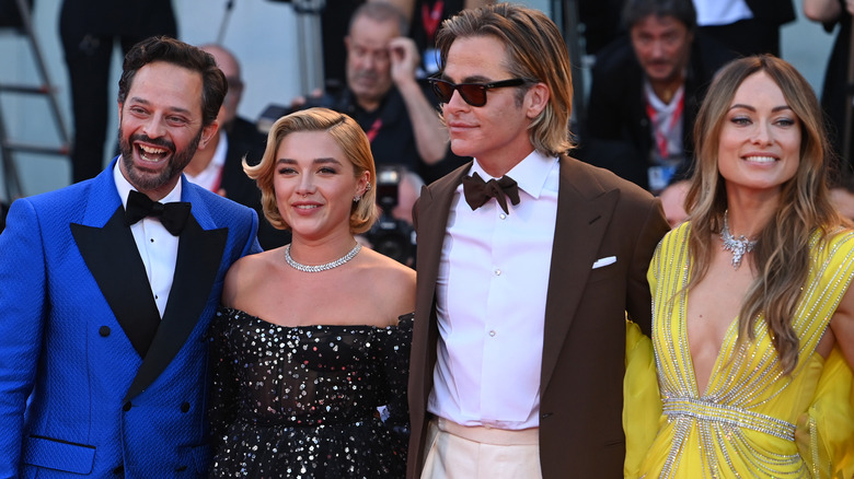 Nick Kroll, Florence Pugh, Chris Pine, and Olivia Wilde smile at Venice Film Festival red carpet