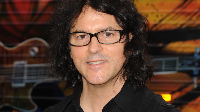 Kerry Simon wearing black glasses